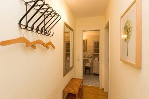 a hallway of a home with a room with a table at Villa Frohsinn App 15 in Bansin
