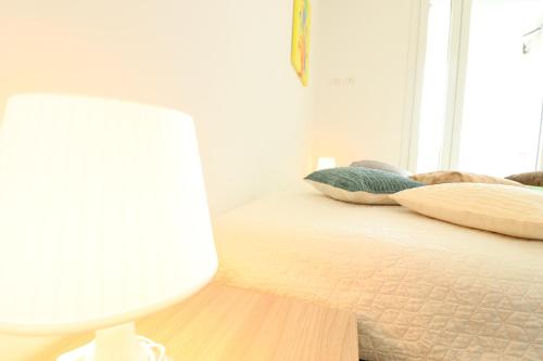 Postel nebo postele na pokoji v ubytování Holiday House Greta in Otranto