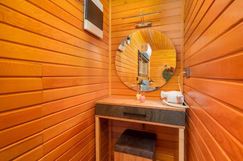 a sauna with a mirror and a sink at Collesium Garden in Antalya