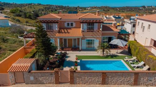 an aerial view of a house with a swimming pool at Casa Moreira in Lagos