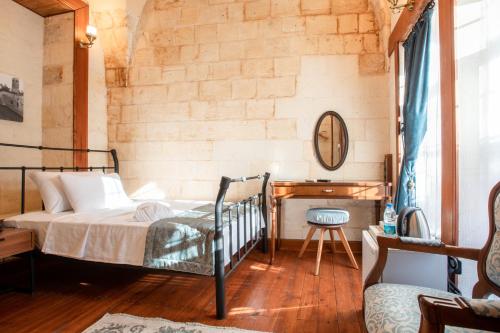 En eller flere senge i et værelse på VE HOTELS ŞANLIURFA