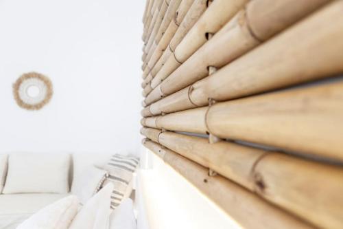 a pile of wood on a shelf next to a window at The View in Megalochori
