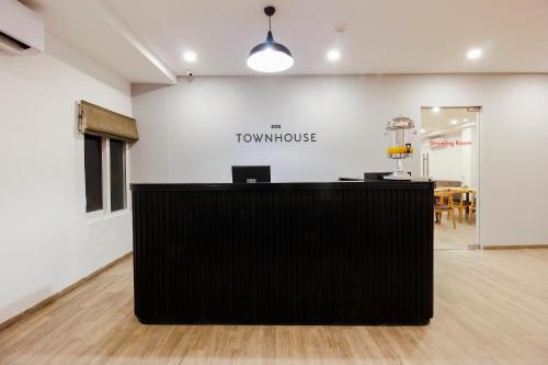 a view of a counter in a room with a table at Super Townhouse RCC Elite in Hyderabad