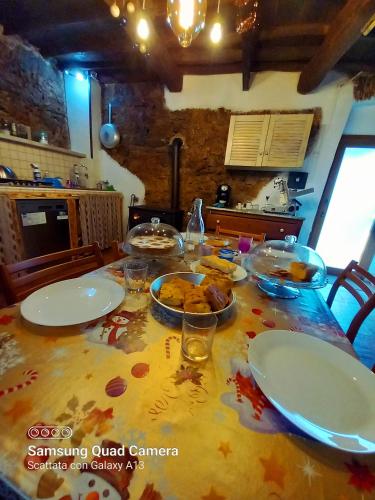 a table with plates of food on top of it at A Casa Di Gaia in Riccò del Golfo di Spezia