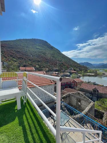 a balcony with a view of a mountain at JG Studio apartment in Vranjina
