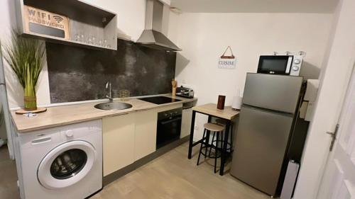 Una cocina o zona de cocina en Superbe appartement proche Gare