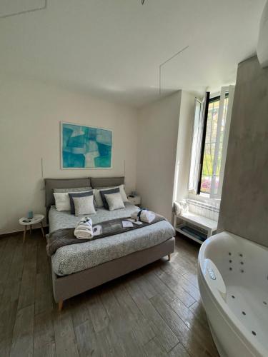 a bedroom with a bed and a bath tub at The Secret Garden in Salerno
