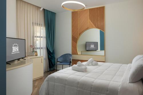 Postel nebo postele na pokoji v ubytování Hotel Brilant Saranda