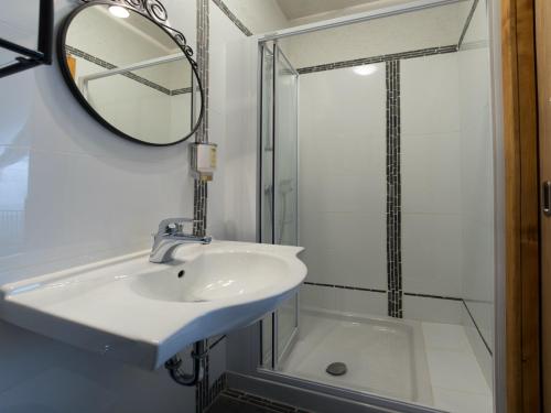 a bathroom with a sink and a shower at Guesthouse Stari Tišler in Ljubljana