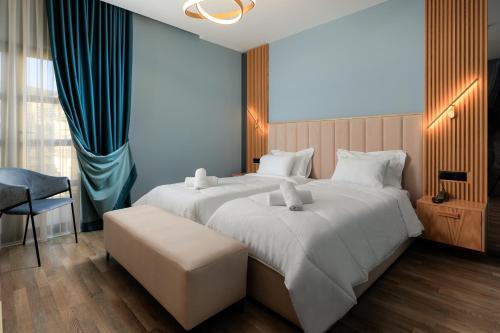 Postel nebo postele na pokoji v ubytování Hotel Brilant Saranda