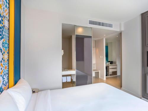 Ένα ή περισσότερα κρεβάτια σε δωμάτιο στο Ibis Styles Phuket City