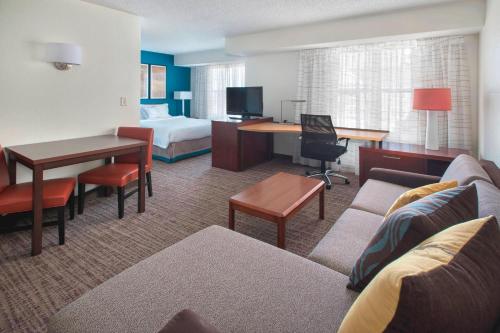 a hotel room with a bed and a living room at Residence Inn Long Island Hauppauge/Islandia in Hauppauge