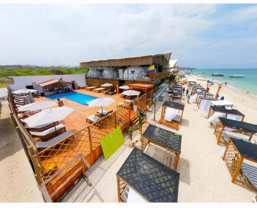 an overhead view of a beach with chairs and umbrellas at La Cabaña Glamping Geronimo in Playa Blanca