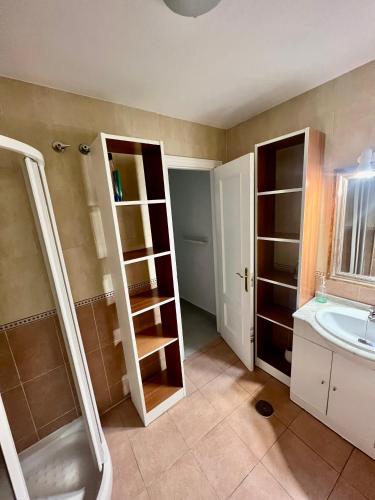 a bathroom with a shower and a sink at Home Boutique Cervantes in Málaga