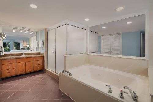 a large bathroom with a tub and a sink at Marriott's Harbour Point and Sunset Pointe at Shelter Cove in Hilton Head Island