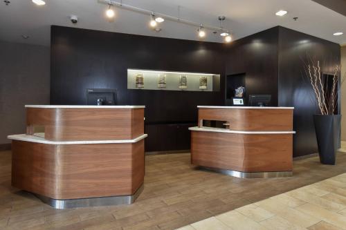 a salon with wooden counters and a black wall at Courtyard Charlotte Concord in Concord
