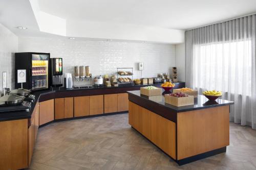a lobby of a hotel with a breakfast buffet at Fairfield by Marriott Inn & Suites Denver Airport in Denver