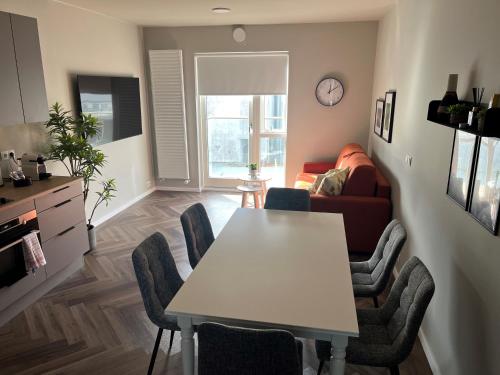 a living room with a table and a couch at Iceland SJF Apartments - 401 in Reykjavík