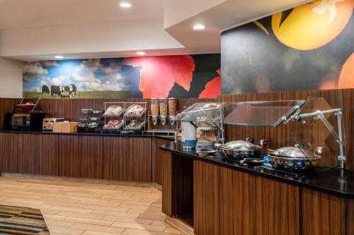 a restaurant with a counter with pots and pans at Fairfield Inn & Suites by Marriott Denver Aurora/Medical Center in Aurora