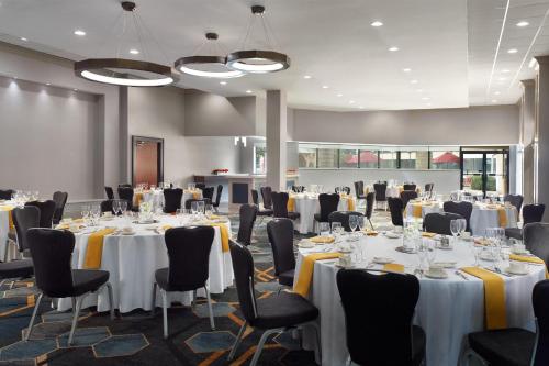a conference room with white tables and chairs at Sheraton Imperial Hotel Raleigh-Durham Airport at Research Triangle Park in Durham