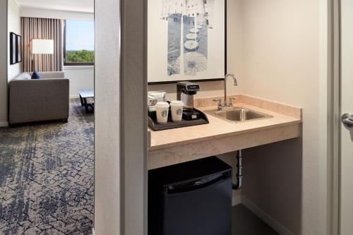 a bathroom with a sink in a hotel room at Sheraton Imperial Hotel Raleigh-Durham Airport at Research Triangle Park in Durham