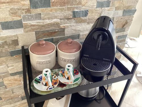 a coffee maker on a shelf next to a stove at Diego's Apartment - Monza Park in Biassono