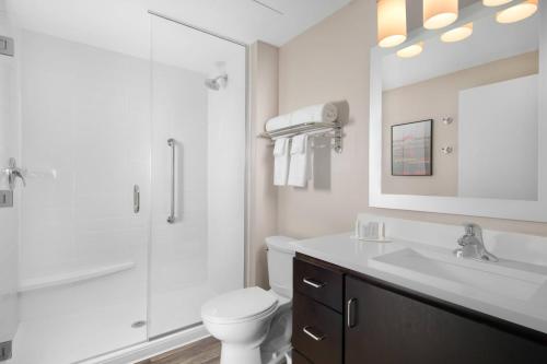 a bathroom with a shower and a toilet and a sink at TownePlace Suites by Marriott Nashville Smyrna in Smyrna