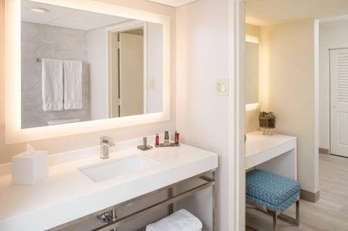 a bathroom with a sink and a mirror at Miami Airport Marriott in Miami