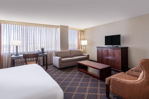a hotel room with a bed and a television at Austin Southpark Hotel in Austin
