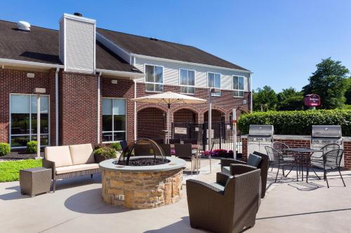 a patio with a fountain in front of a building at Residence Inn Philadelphia Willow Grove in Horsham