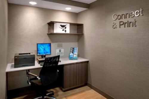 an office with a desk with a computer and a chair at Fairfield Inn & Suites by Marriott Great Barrington Lenox/Berkshires in Great Barrington