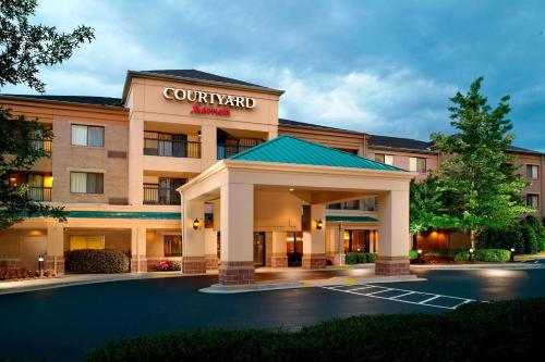 a rendering of a hotel with a courtyard inn at Courtyard by Marriott Atlanta Alpharetta in Alpharetta