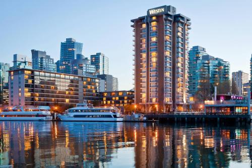 a view of a city with boats in the water at The Westin Bayshore, Vancouver in Vancouver