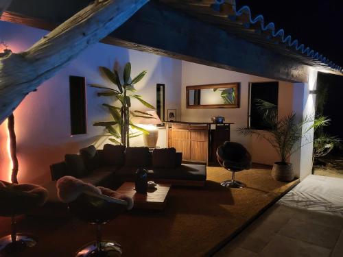 a living room with a couch and a table at Hotel Bastide & SPA - Villa de Lourmarin in Lourmarin