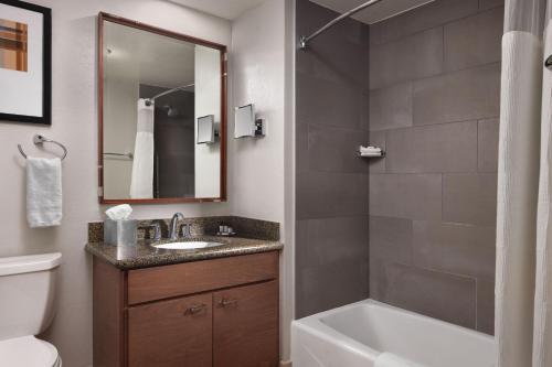 a bathroom with a sink and a tub and a toilet at Marriott's Summit Watch in Park City