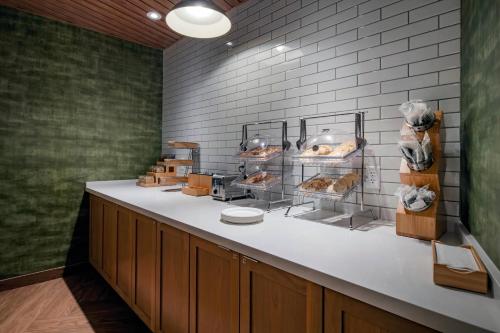 a bakery with a counter with breads and pastries at Fairfield Inn & Suites by Marriott Klamath Falls in Klamath Falls