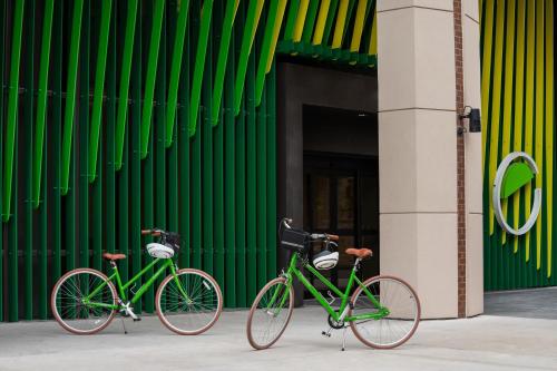 two bikes parked in front of a green wall at Element San Antonio Riverwalk in San Antonio