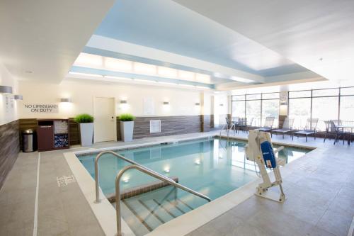 a large swimming pool in a building at Fairfield Inn & Suites by Marriott Decorah in Decorah