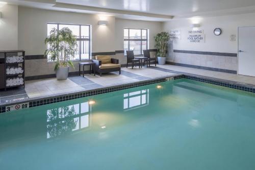 a swimming pool in a building with a waiting room at Fairfield Inn & Suites South Bend at Notre Dame in South Bend