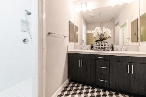 a bathroom with a large sink and a shower at NEW! PGA West (Signature!) walk to Stadium Course! in La Quinta