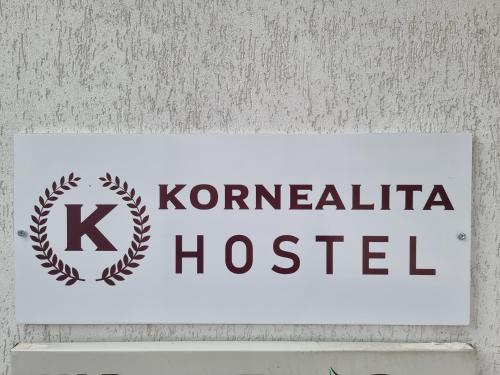 a sign that says koreanatal hospital on a wall at Hostel Kornealita in Zarasai