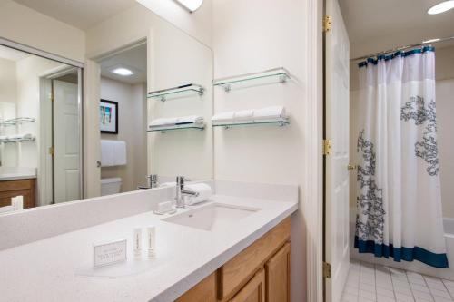 a bathroom with a sink and a mirror at Residence Inn Salt Lake City Cottonwood in Cottonwood Heights