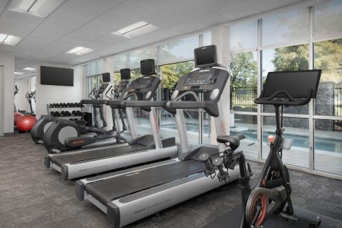 a gym with several treadmills and cardio machines at SpringHill Suites by Marriott Tuscaloosa in Tuscaloosa