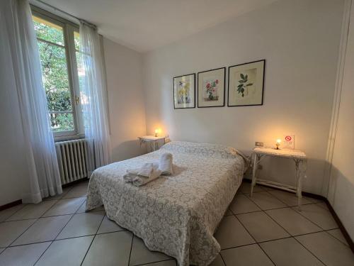 A bed or beds in a room at Casa Viale Amico - Giardino Privato