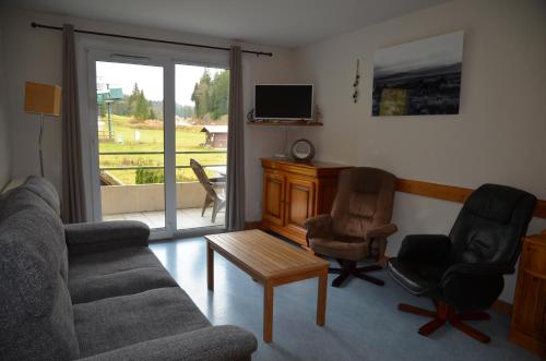 Photo de la galerie de l'établissement Le Repaire du Loup blanc, à Prémanon