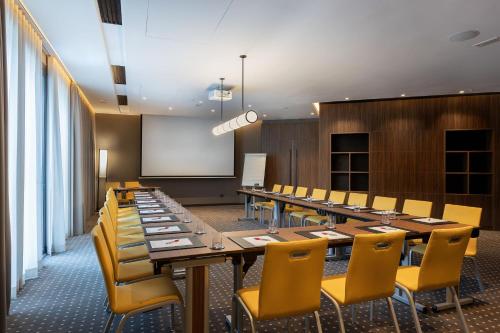 a conference room with a long table and chairs at Tunis Marriott Hotel in Tunis