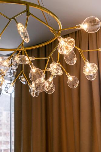 a chandelier hanging from a ceiling in a room at Royal Montesun Apartments in Budva