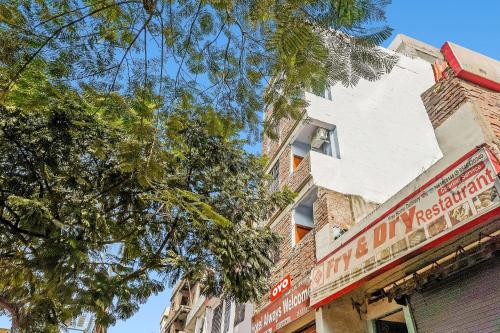 a building with a sign on the side of it at Flagship Hotel Always Welcome in Patna