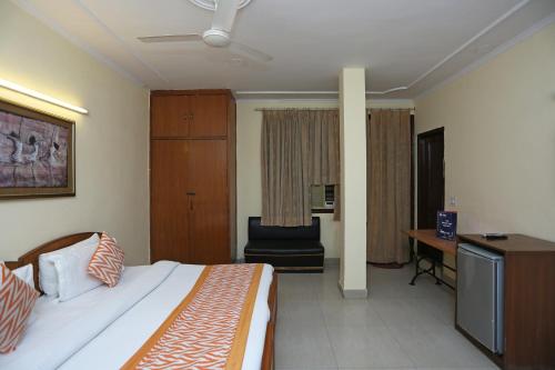 Ένα ή περισσότερα κρεβάτια σε δωμάτιο στο Hotel O Kalkaji Residency Bnb Near Lotus Temple
