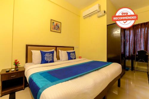 a bedroom with a bed with a sign that reads recommended at Super OYO Flagship Hotel Diamond In in Kakkanad